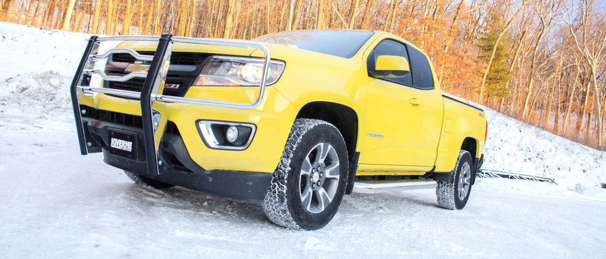 Yellow 2017 Chevrolet Colorado with LUVERNE MegaStep® running boards and grille guard