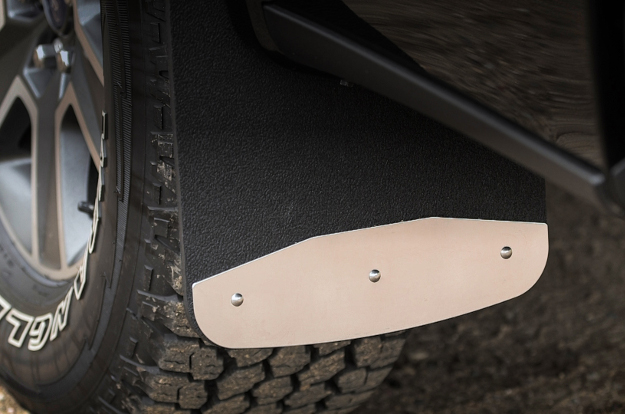 Mud flaps with textured rubber and stainless steel plates