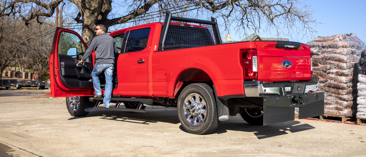 Red Ford F250 work truck with Mud-Guards, Tow Guard and headache rack