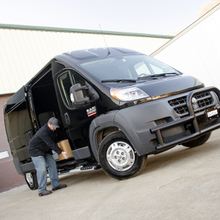 Black Ram ProMaster 2500 work van with LUVERNE O-Mega II™ steps and Tuff Guard® bumper guard