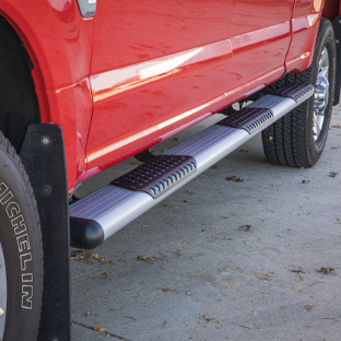 Red truck with silver O-Mega II™ side steps from LUVERNE