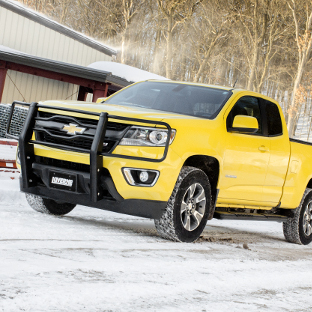 Yellow Chevrolet Colorado with LUVERNE brush guard and O-Mega II™ side steps