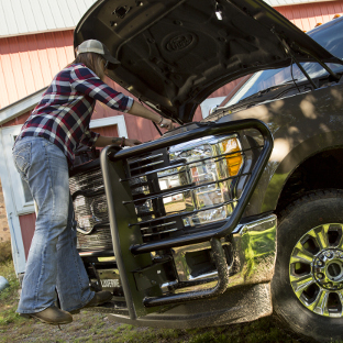 Engine work on Ford F350 with LUVERNE Prowler Max™ grille guard step