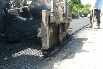 During construction: Filling geocell with gravel, sweet soil & grass mat