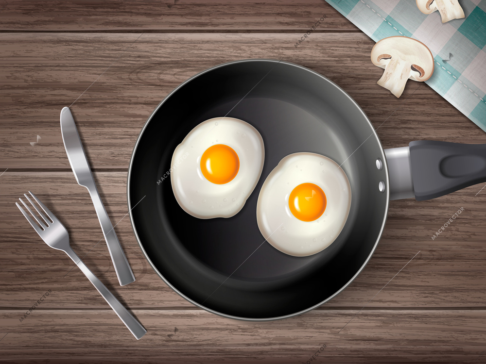 Realistic cookware composition with top view of cutlery and frying pan with two fried eggs on wooden surface background vector illustration