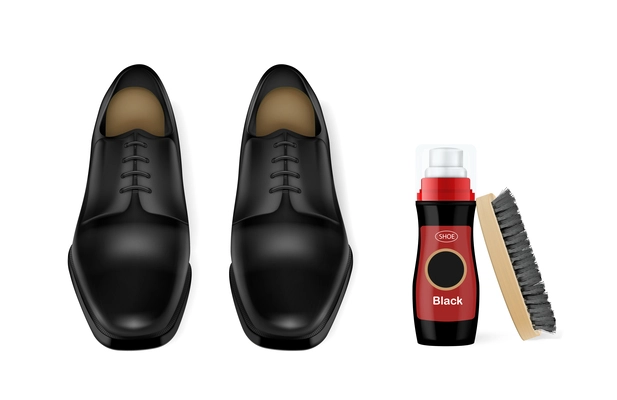 Black pair of shiny leather male shoes with shoe polish and brush realistic composition vector illustration