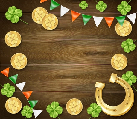 Saint patricks day frame on wooden background with golden horseshoe and coins, clover, colorful pennants vector illustration