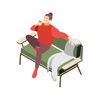 Hygge lifestyle isometric composition with character of relaxing girl sitting on soft couch with hot drink vector illustration