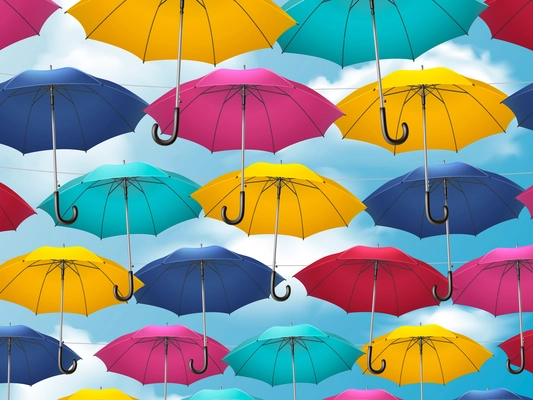 Realistic umbrella composition colorful umbrella canes connected together hanging against the sky vector illustration