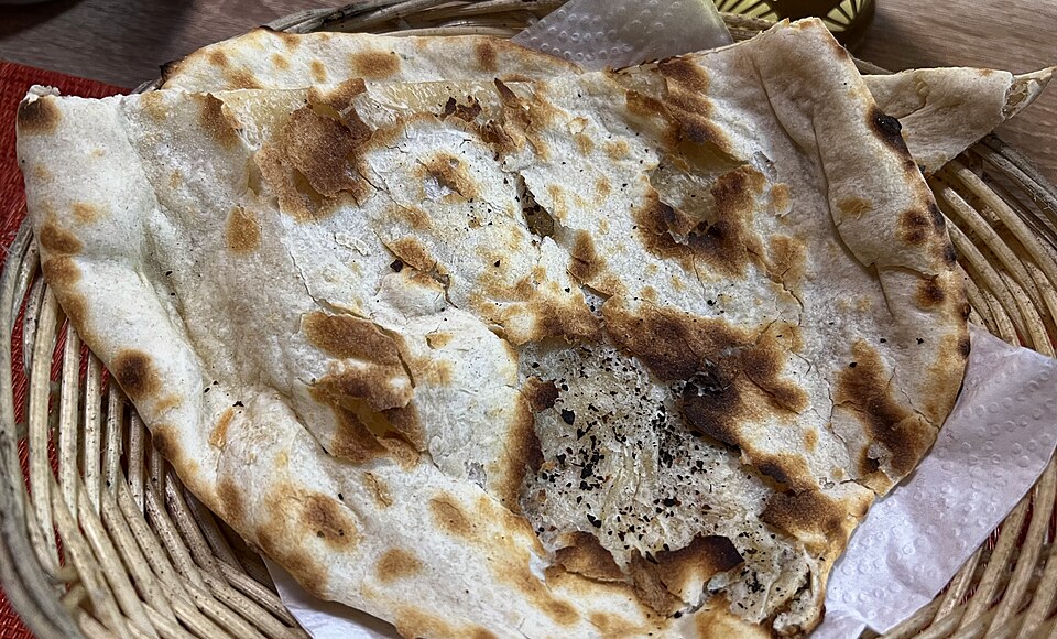 Freshly baked Indian naan in a basket