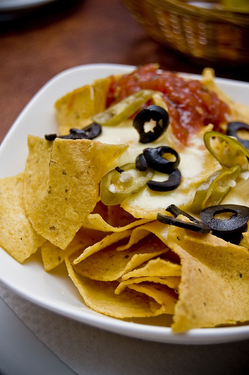 Cheesy nachos with jalapenos and olives