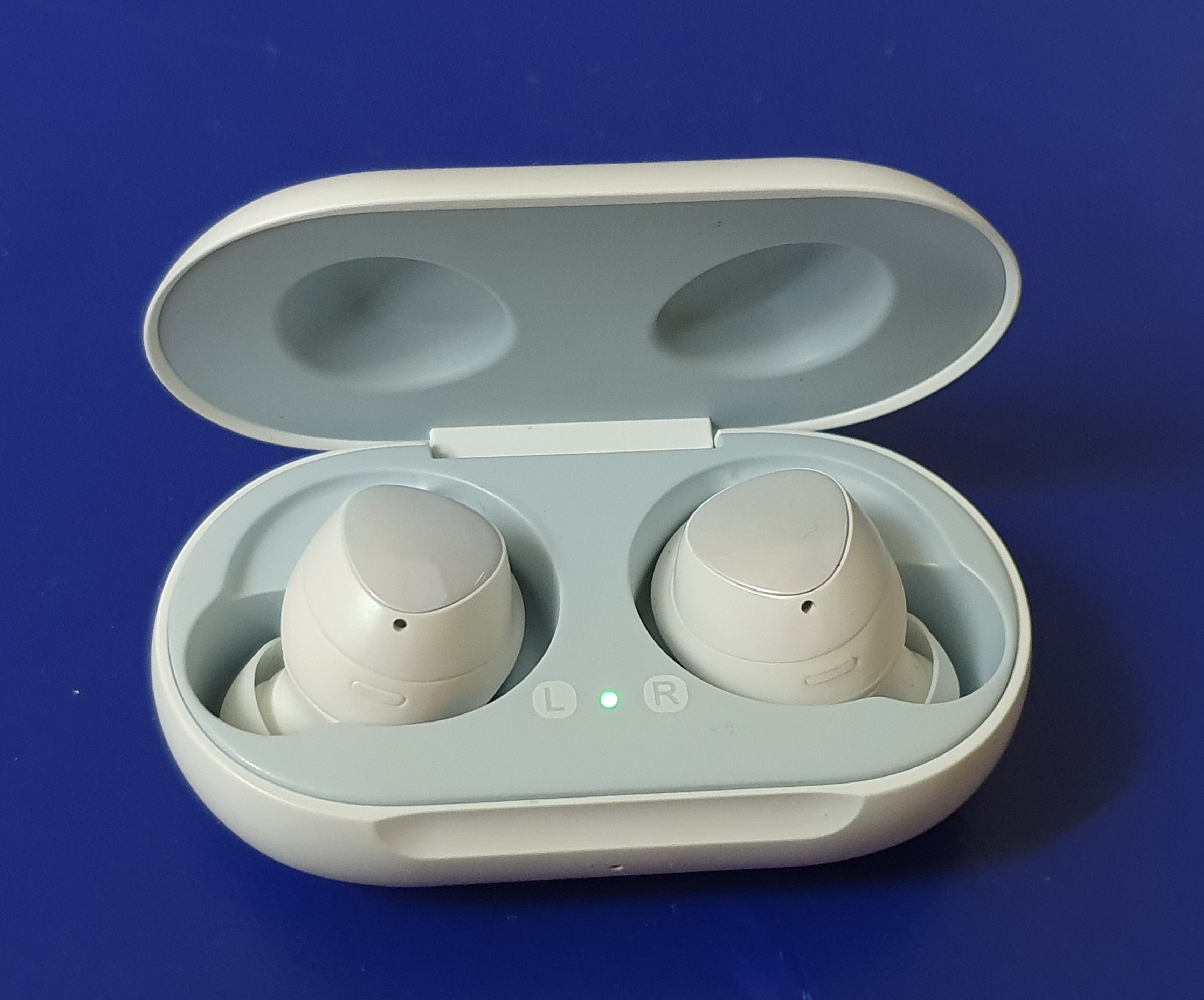 Wireless earbuds in their charging case