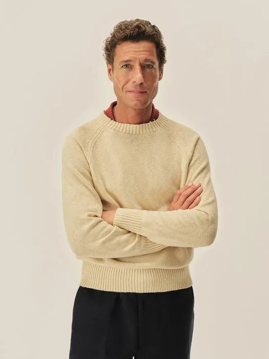 Model facing forward with arms crossed wearing natural venice wash cotton crew sweater