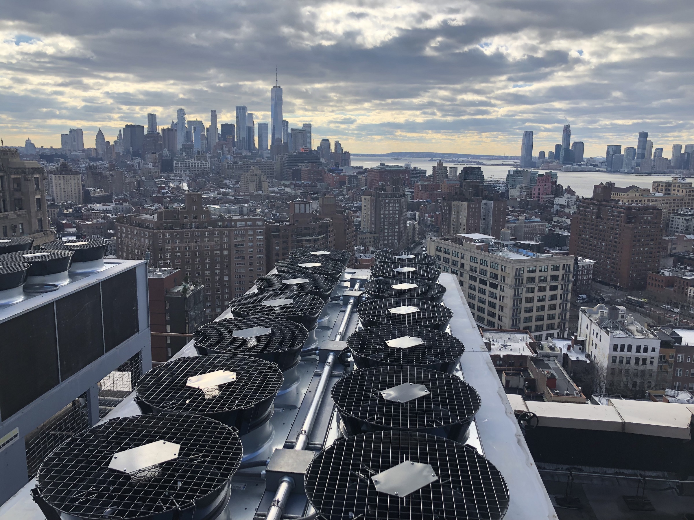 New York skyline showing a row of drycoolers, part of the HVAC solutions installed for this client by Mantis Innovation