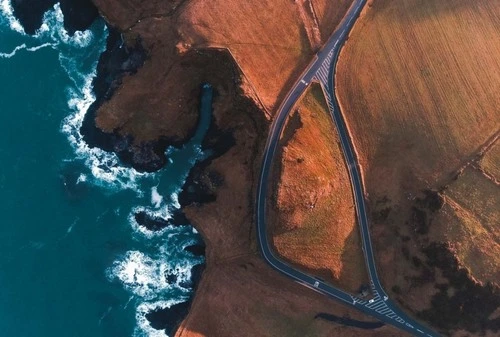 Split In The Road - Aus Near Dunluce Castle - Drone, United Kingdom