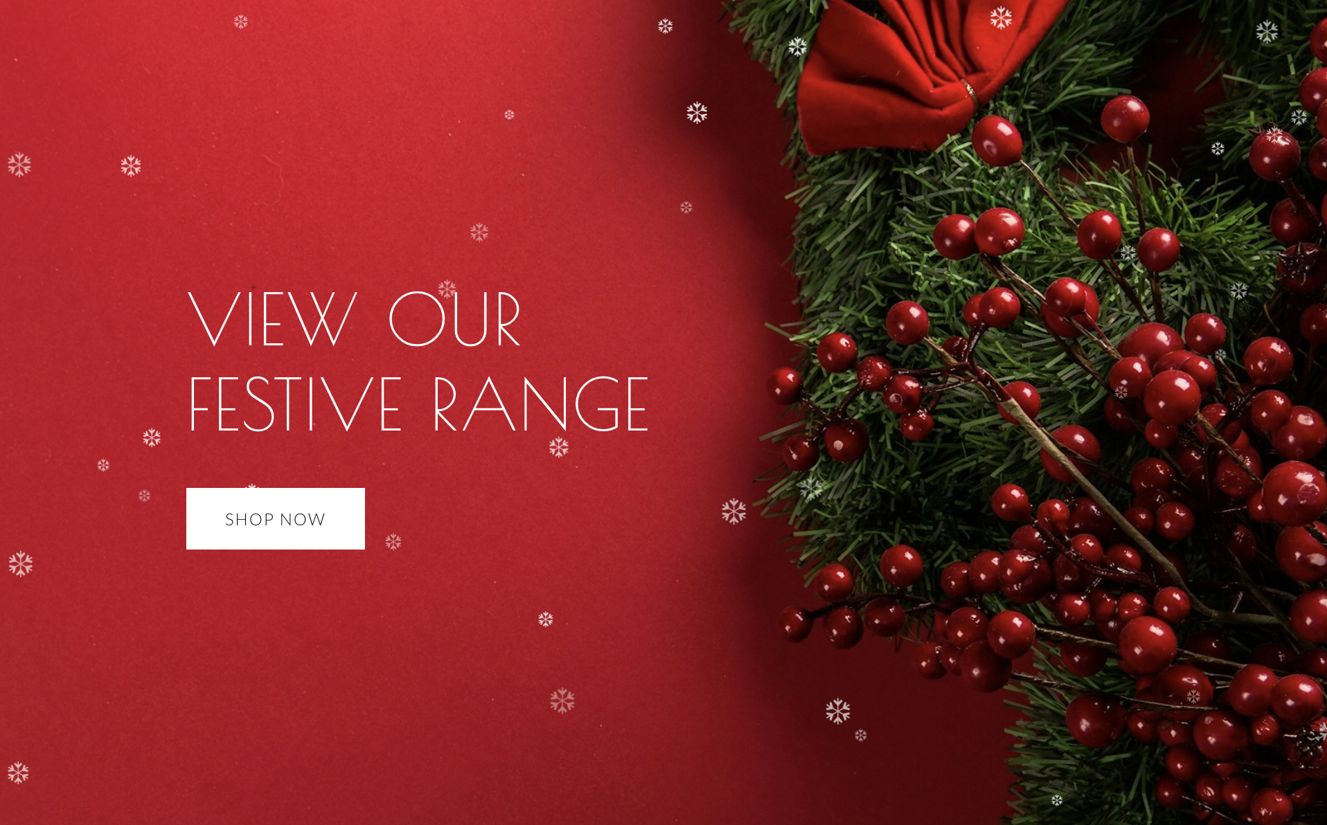 Hero section of a website with snowfall effect enabled in the background