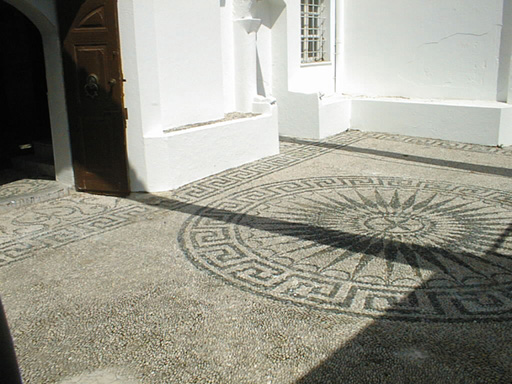 A picture of the mosaic floor of the synagogue at Rhodes. Most of the walkways in Rhodes were made of small stones - although usually not in this ornate of a pattern.