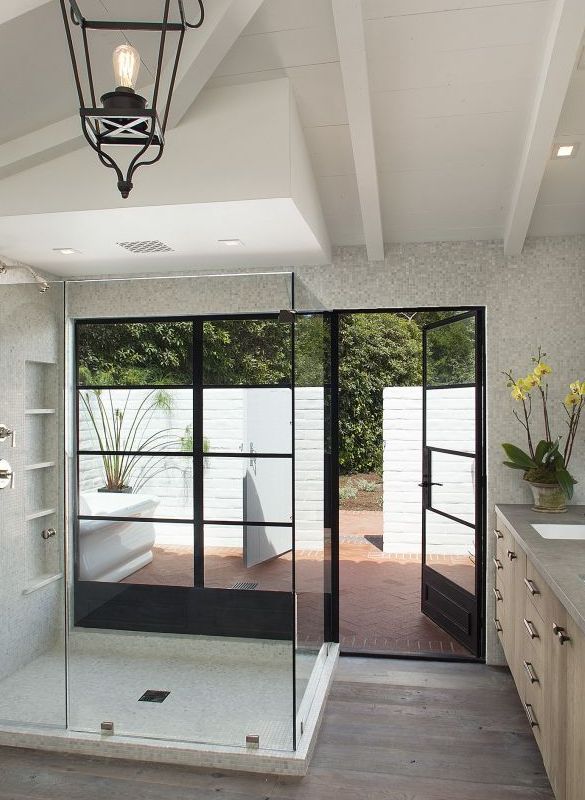 large open glass shower with view of patio