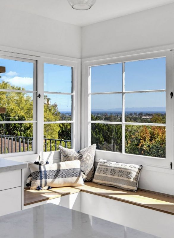 kitchen sitting nook under large windows