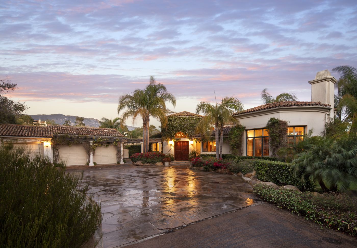 front driveway with lit front door