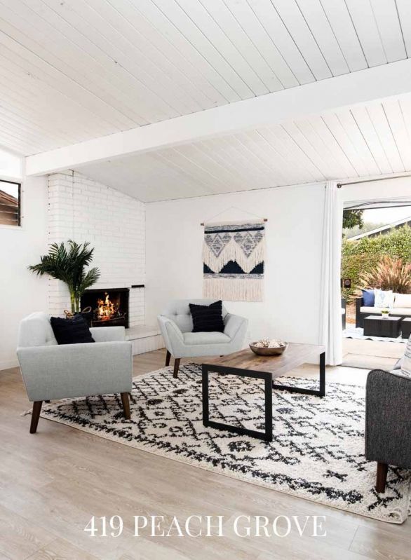 living room chairs and table near fireplace