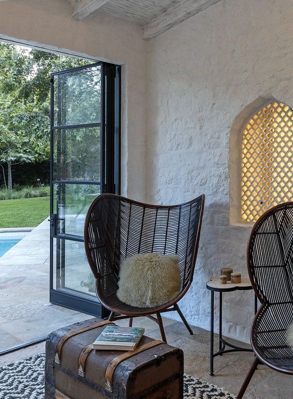 sitting area with doors open to pool