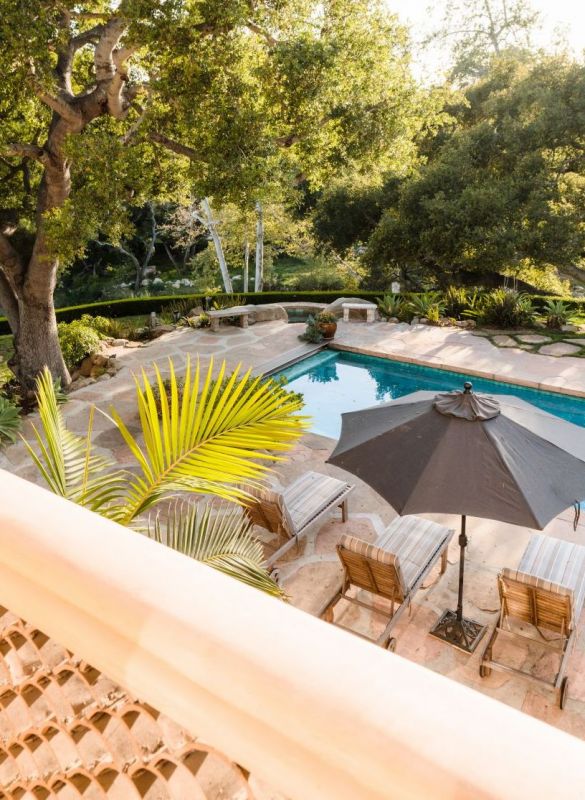 backyard pool and lounge chairs