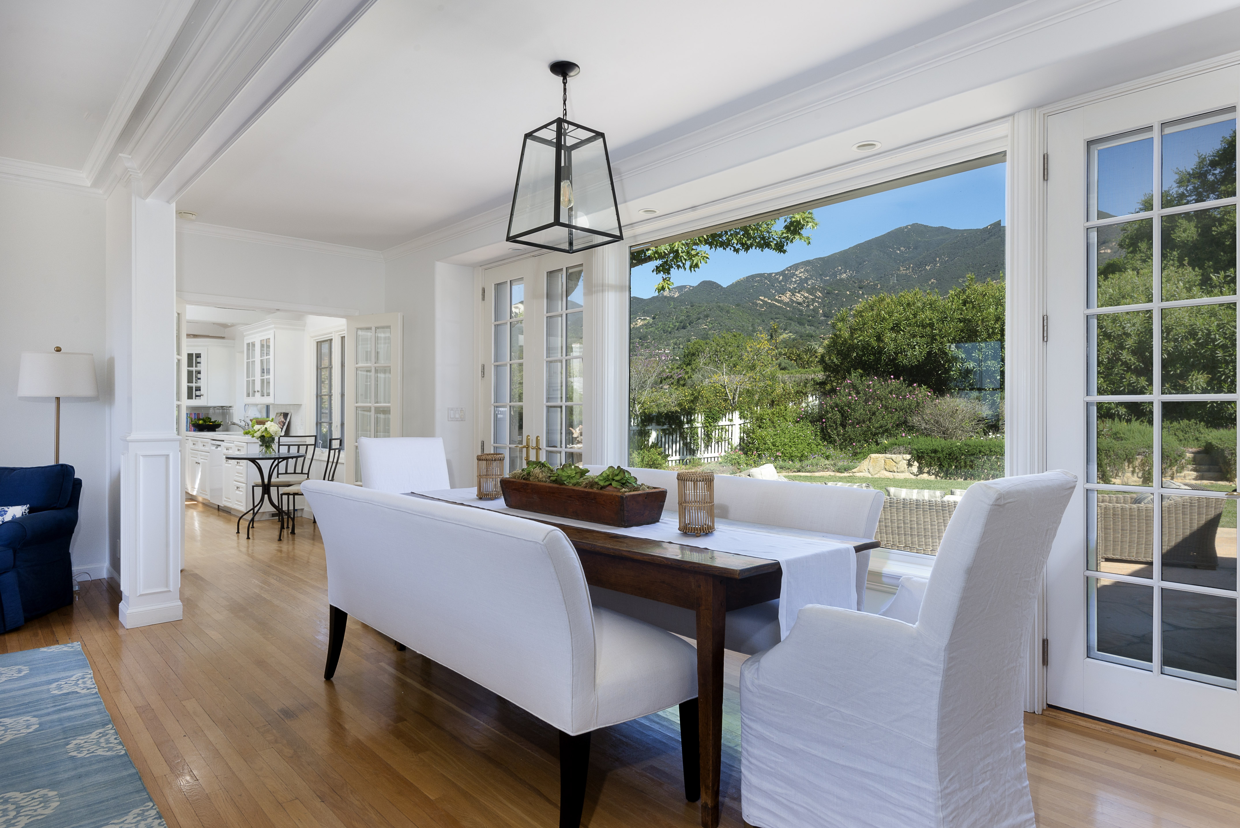 dining table in front of large windows