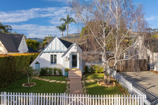 Tudor Revival home exterior in Santa Barbara with steep gables, half timbering, and leaded windows