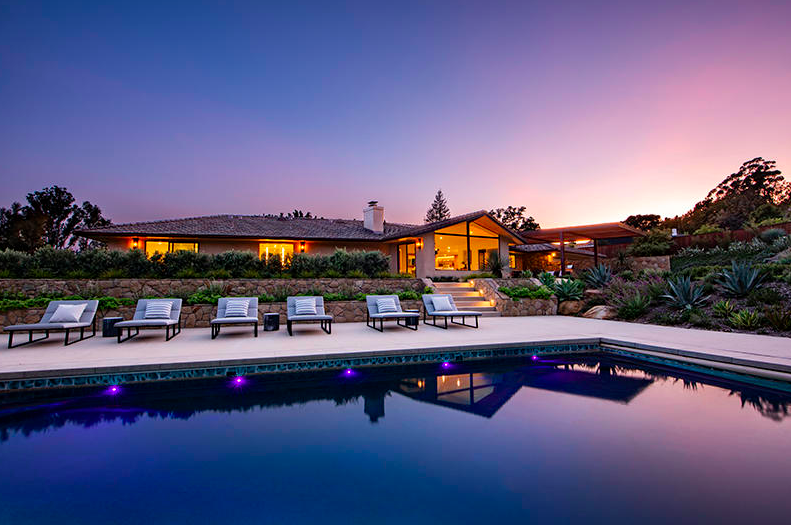 poo and lounge chairs at sunset