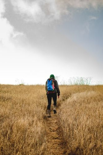 person hiking up hill