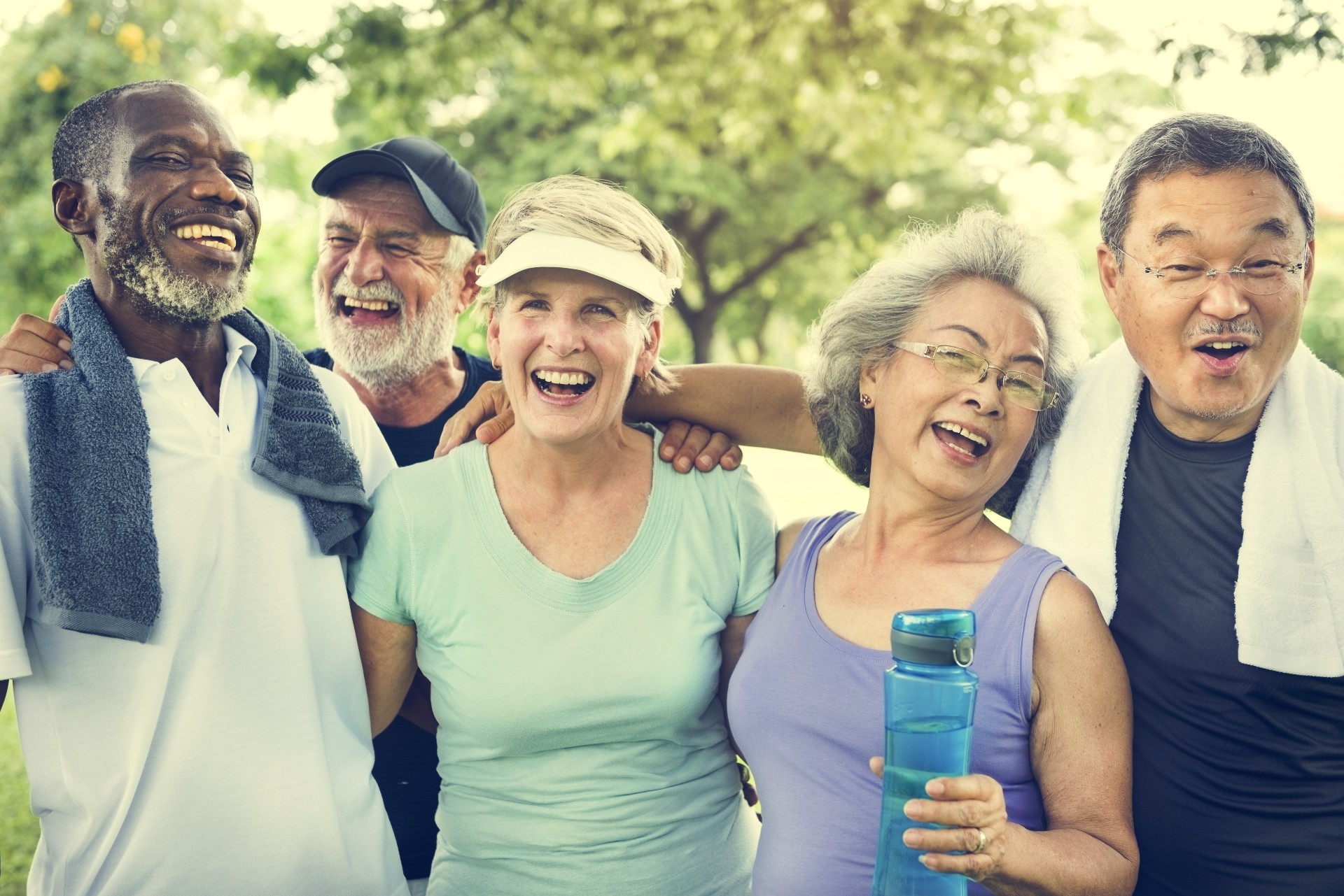 Group of happy seniors exercising together
