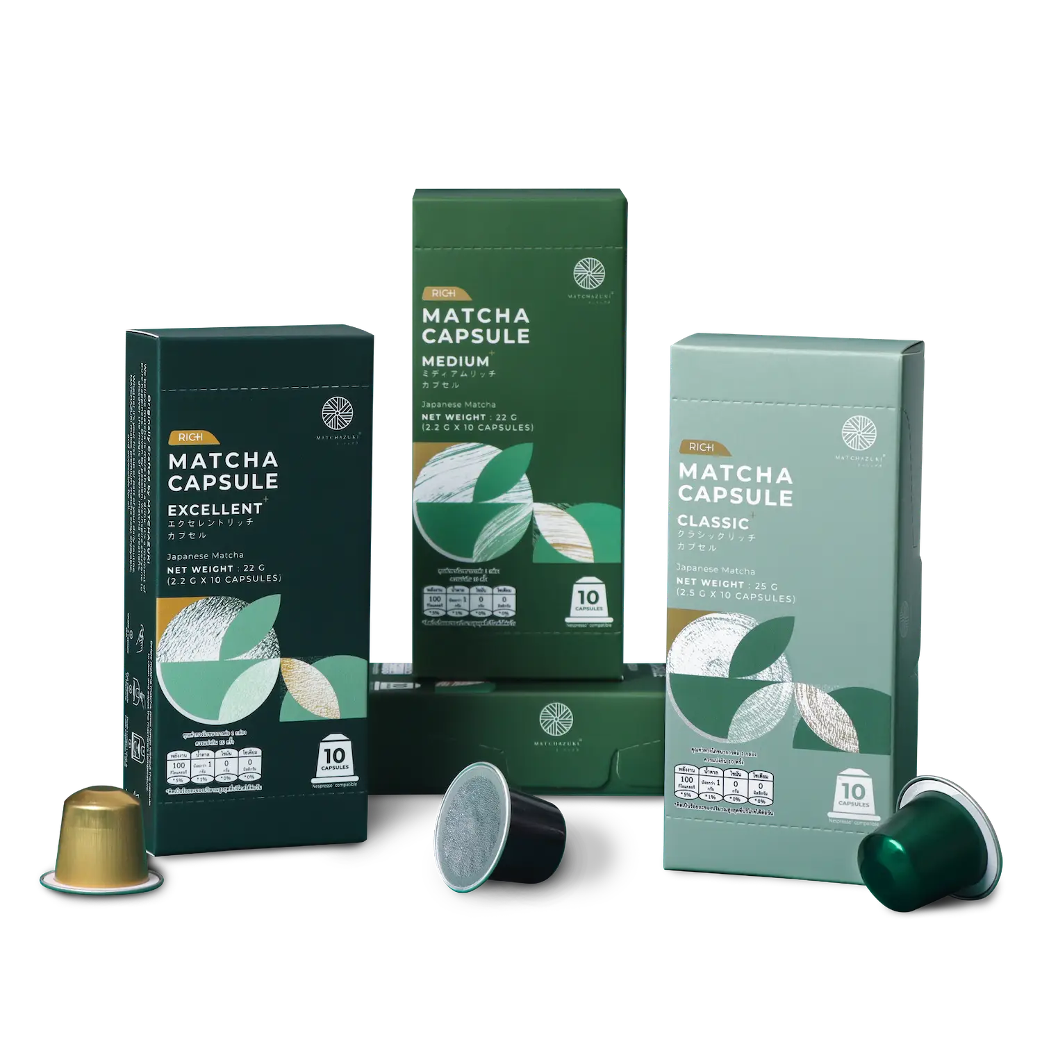 Boxed matcha capsules in green packaging, visible front labels reading 'MATCHA CAPSULE' and 'MEDIUM' among three boxes on a black backdrop.