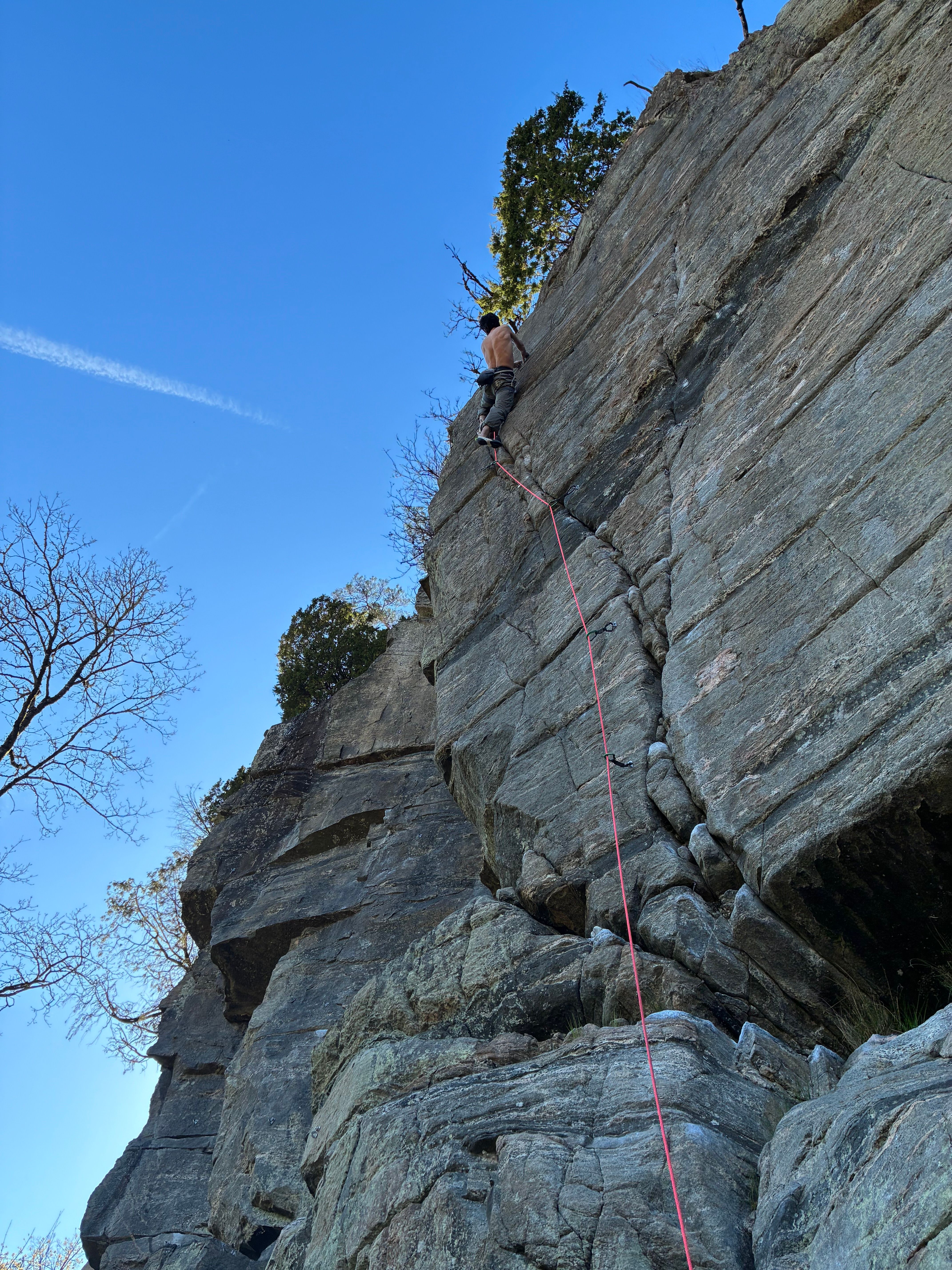 Figuring out the crux on Hybrid (7c), such a great feature.