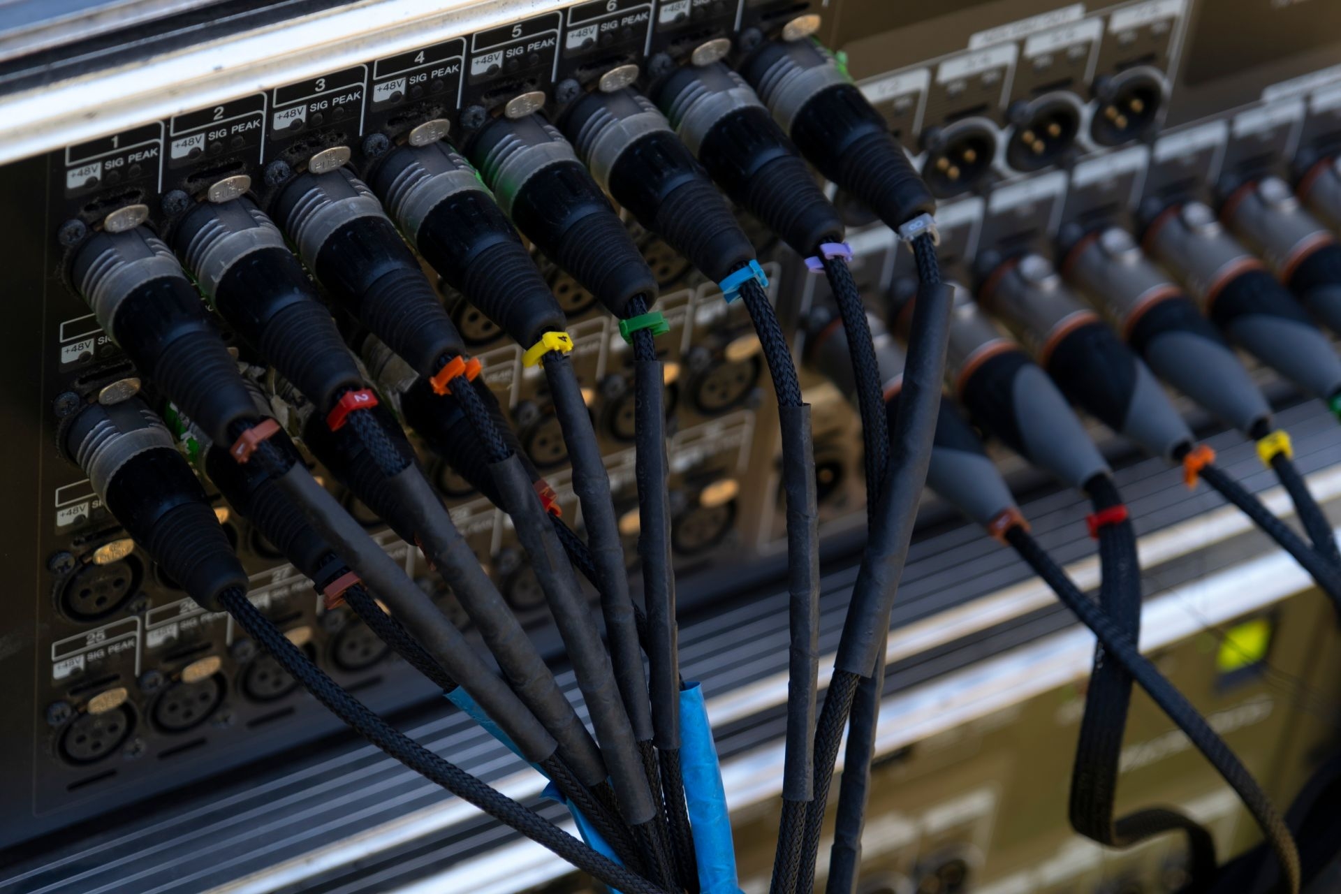 How do sliding shelves in audiovisual racks contribute to efficient use of space?