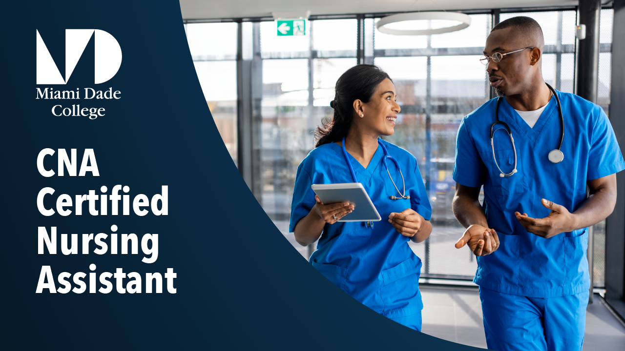 Two smiling medical professionals in blue scrubs, one holding a tablet, walk and converse in a bright hallway. Text: 