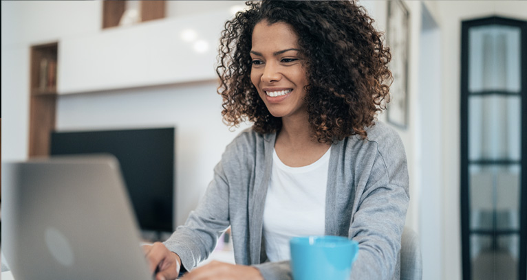 woman using laptop at home