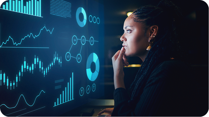 A focused woman with braids studies glowing blue data visualizations, including charts and graphs, representing the IBM SkillsBuild Data Analytics.
