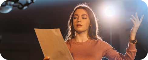 Girl reading scenario on stage