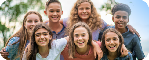 Diverse preteen kids outside together