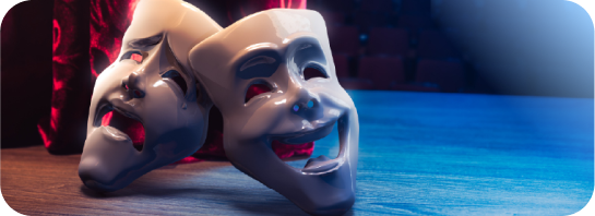 Theater masks over a stage