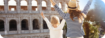 Mother her child waiving at the Colosseum in Rome