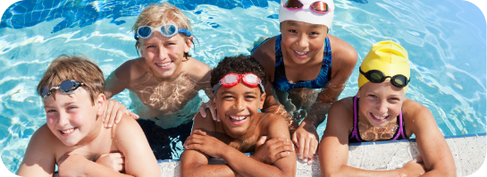 Group of kids having fun in a pool after a swimming activity