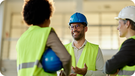 eam of project managers talking at construction site