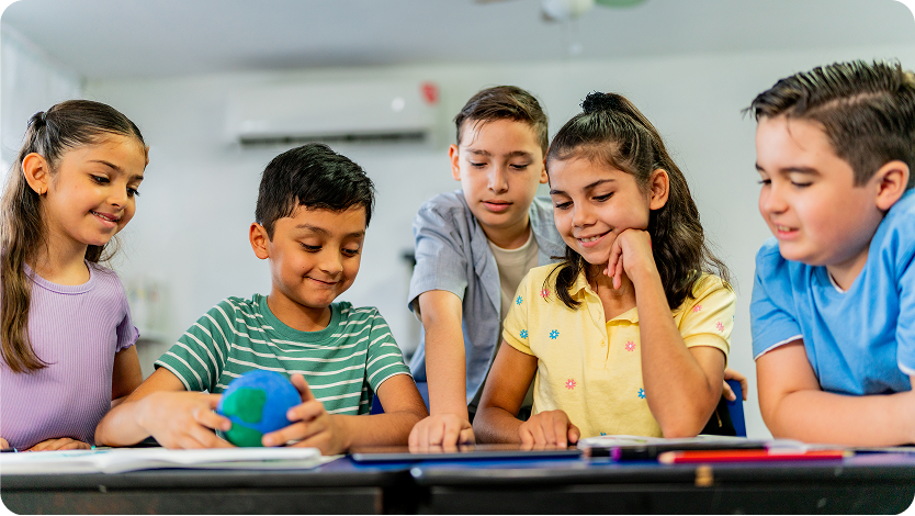 Child students talking during class at school