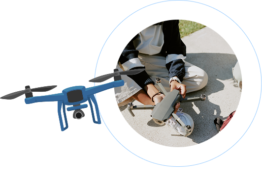 Blue quadcopter drone with camera on left side of image; circular inset on right shows close-up of hands assembling or preparing a drone on a light-colored surface. Metallic gray and blue drone components are visible, with someone wearing light-colored clothing and dark gloves carefully handling drone parts. The composition suggests a technical, educational setting, likely related to drone assembly or maintenance, with a clean, precise aesthetic emphasizing technological learning and precision.