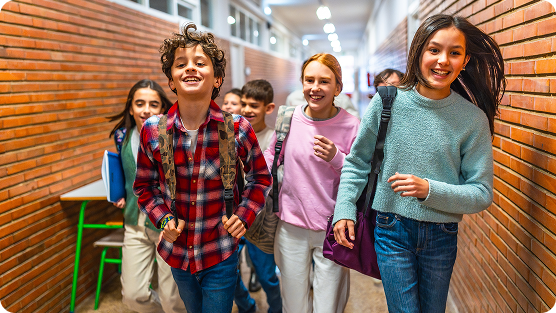 Group of older kids walking to their classroom