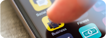 Close-up of a finger hovering near a yellow and black 