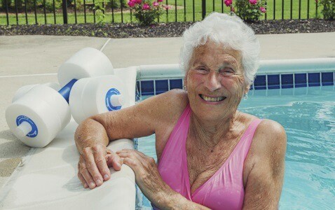 Happy senior woman enjoying the health benefits of swimming