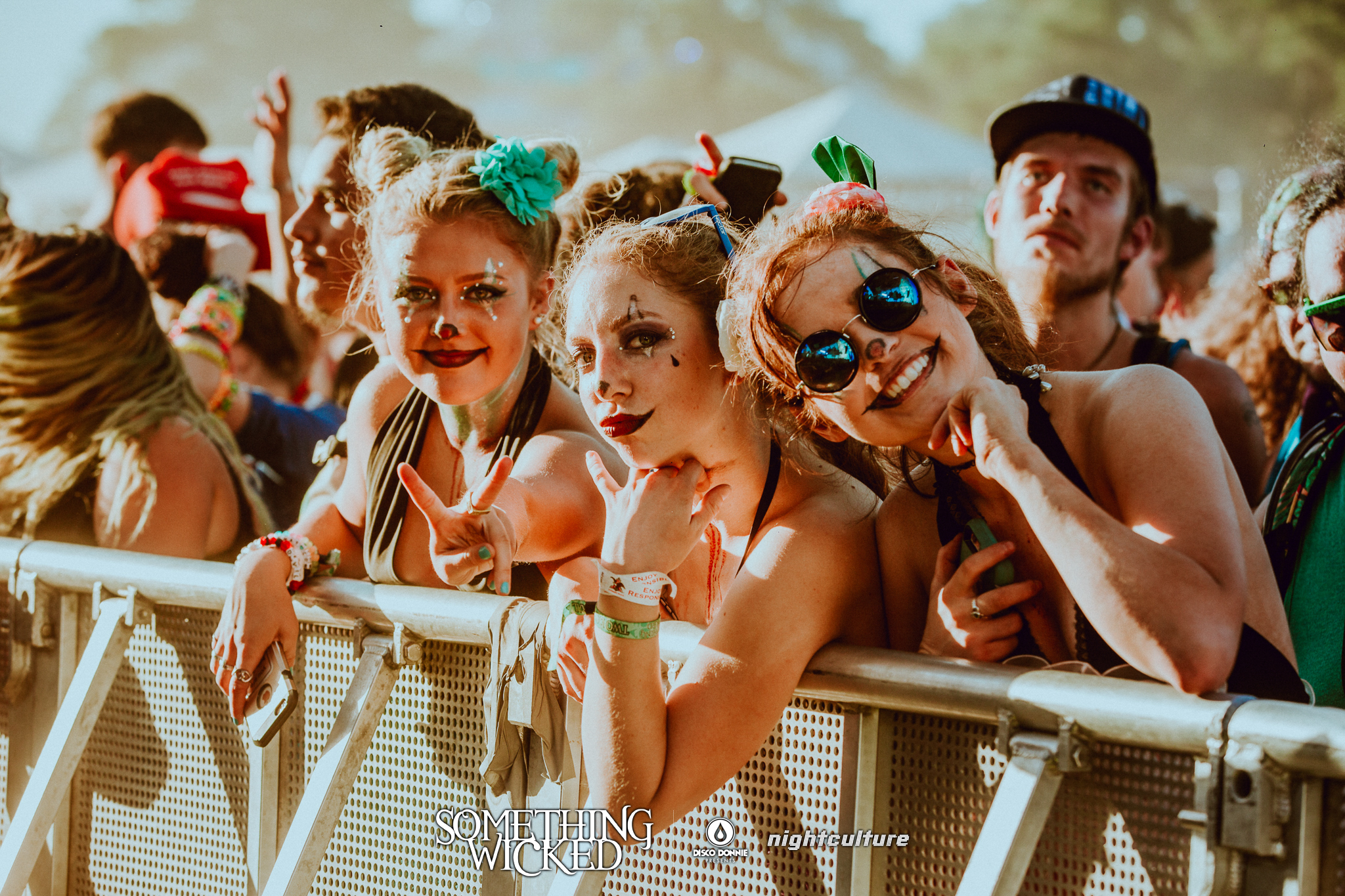 fans with clown face paint